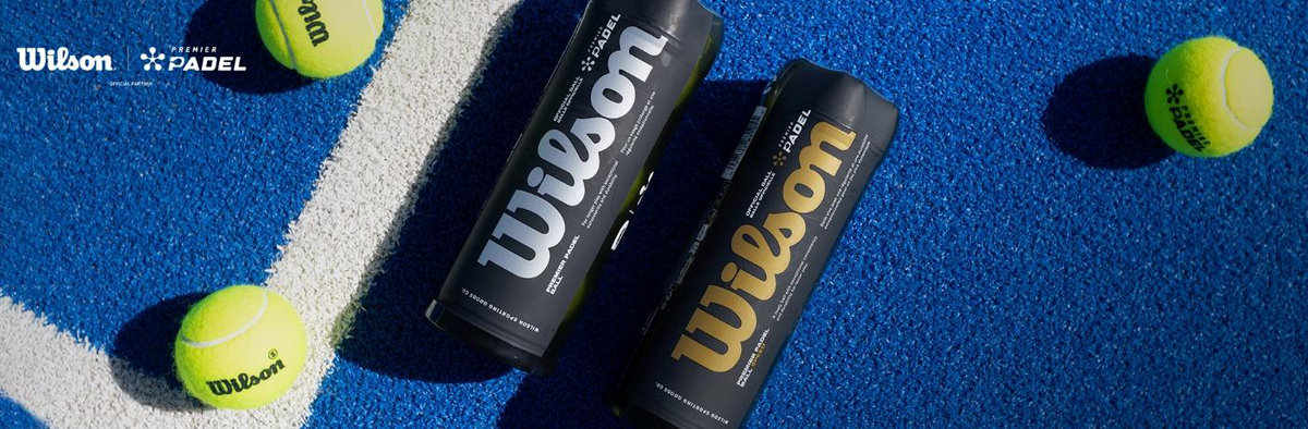 Wilson padel balls on a blue court